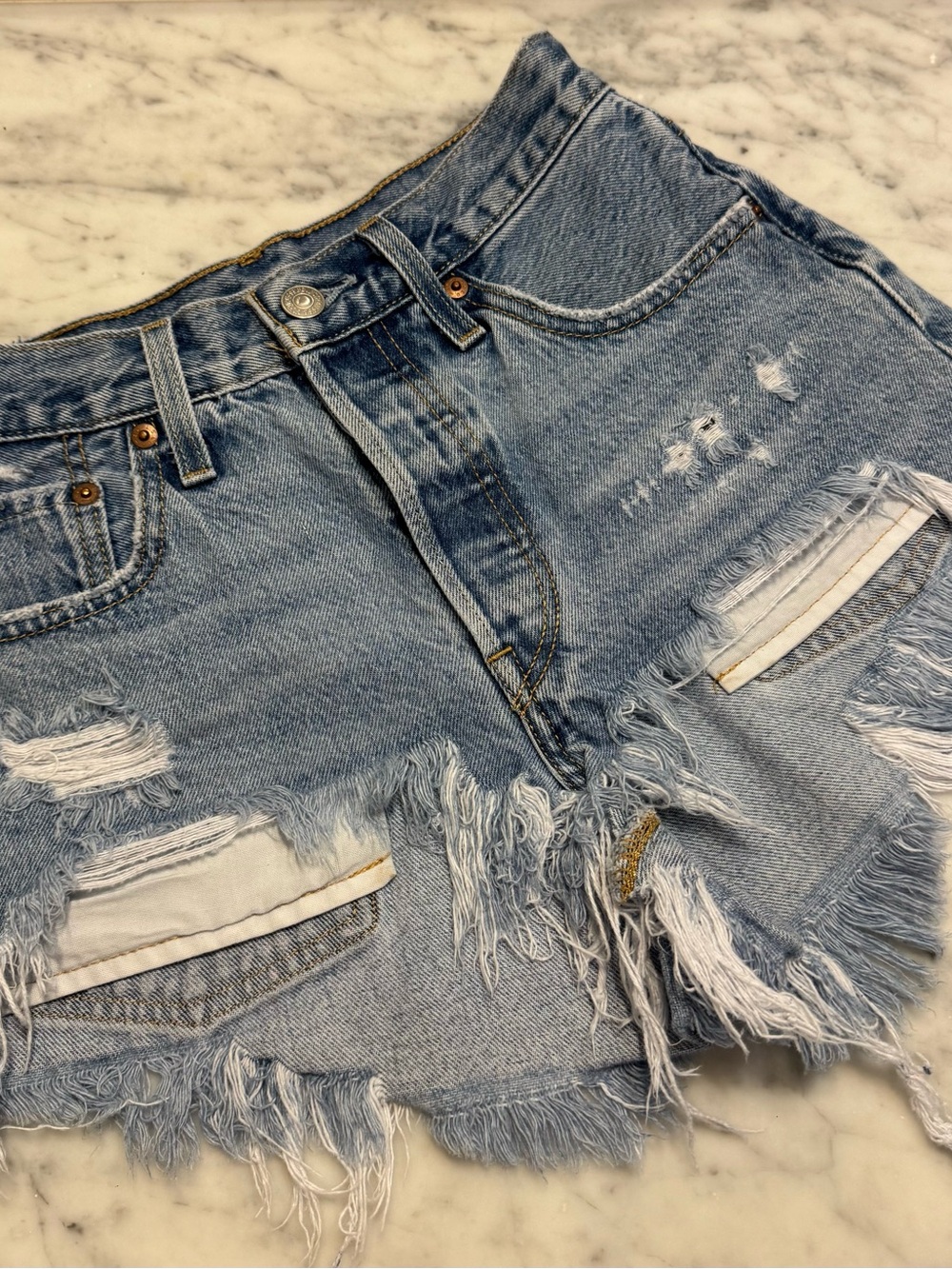 Levi's Light Blue Distressed Denim Shorts